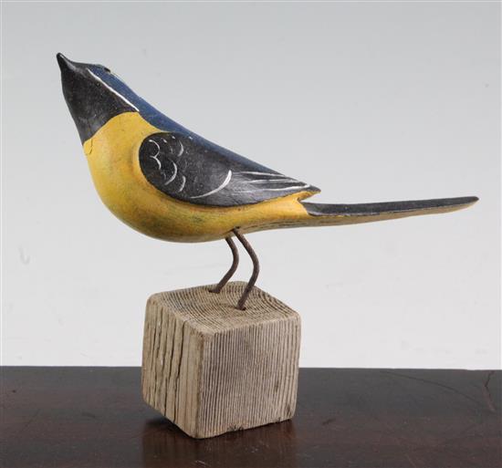 § Guy Taplin (1939-) Yellow Wagtail perched on a stump, height 6in.